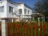 Renovated house near a dam fence